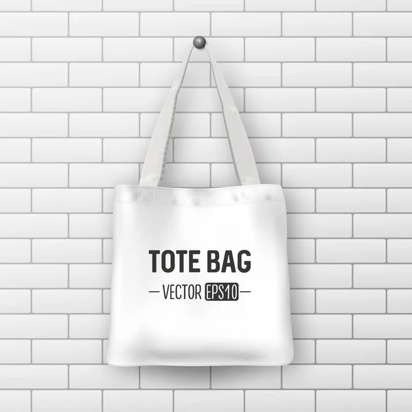 Realistic vector white textile tote bag. Closeup on brick wall background. Design template for branding, mockup. EPS10. — Stock Vector