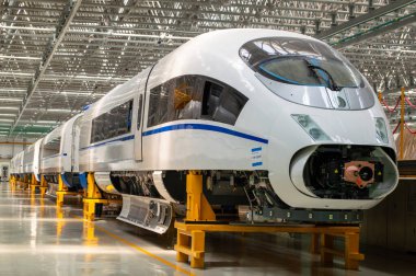 Changchun, Jilin province / China - July 11, 2015: Production hall of CRRC Changchun Railway Vehicles Co. Ltd, leading Chinese manufacturer of high-speed trains, metro and railway clipart