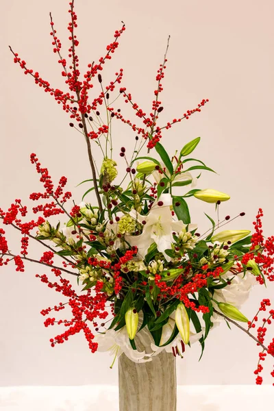 Beautiful Ikebana Japanese art of flower arrangement on white background