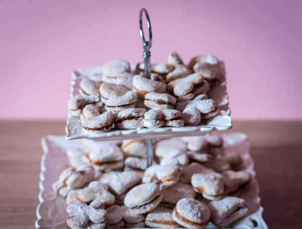 Vanilice, Serbian bite-sized small Vanilla cookies made as sandwich of two vanilla and walnut cookies held together with a dollop of jam, usually served around the Christmas