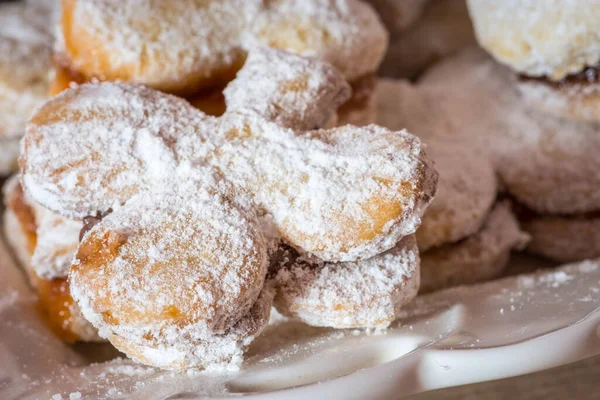 Vanilice, Serbian bite-sized small Vanilla cookies made as sandwich of two vanilla and walnut cookies held together with a dollop of jam, usually served around the Christmas