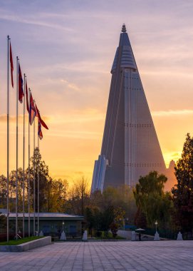 Pyongyang / DPR Korea - November 12, 2015: Ryugyong hotel is an unfinished 105 story, 330 meter tall pyramid shaped skyscraper in Pyongyang and the tallest structure in North Korea clipart