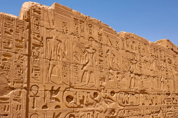 Relief details and Egyptian hieroglyphs at Karnak temple complex and Karnak Open Air Museum (built about 1250 BC) in Luxor, Egypt