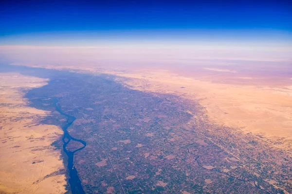 Aerial airplane view of Nile river valley and the surrounding Sahara desert in Egypt