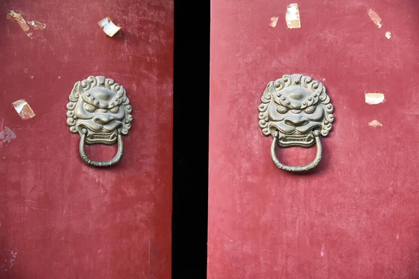 Chinese door knob knockers. Lion head door knockers used to knock the door, scene from Hutong narrow alley in Beijing.