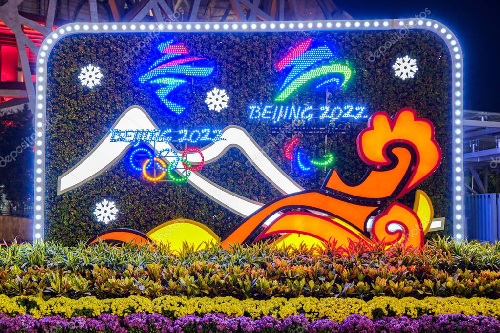 Beijing / China - October 11, 2018: Decorative stand promoting the Beijing Winter Olympics 2022 in front of the Beijing National Stadium (