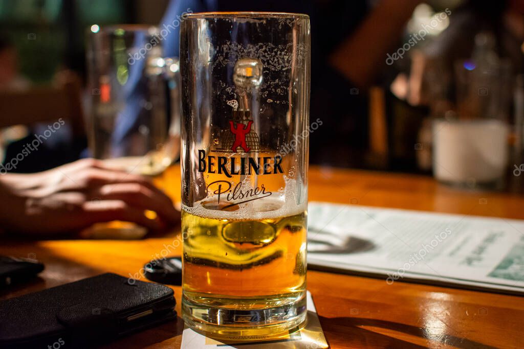 Berlin, Germany - March 8, 2017: Glass of Berliner Pilsner beer served in a bar in Berlin, Germany