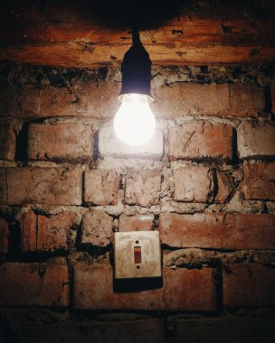 A lamp on the background of a brick wall