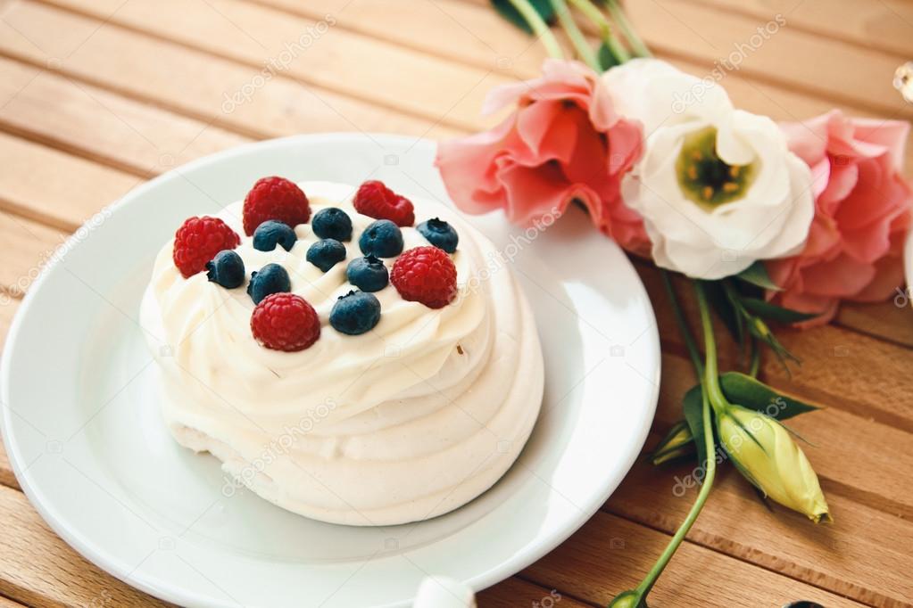 Traditional dessert Pavlova cake with fresh berries