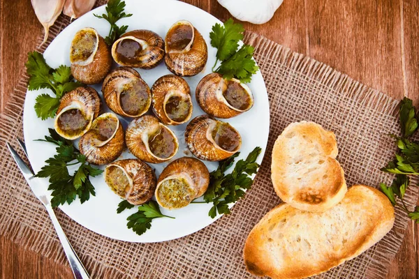Snails with herbs butter — Stock Photo, Image
