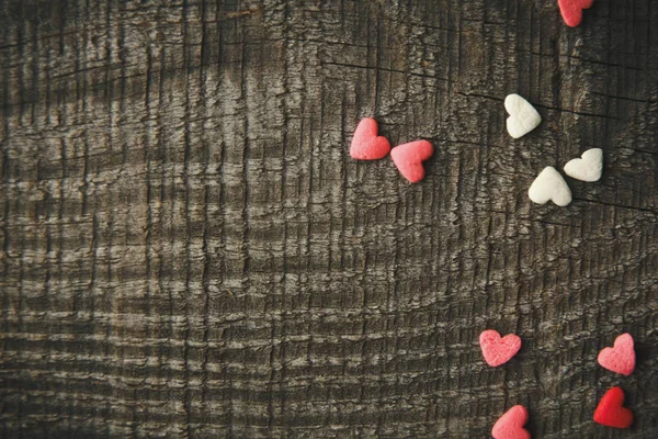Beautiful and cute background for Valentine's day with hearts on vintage boards — Stock Photo, Image