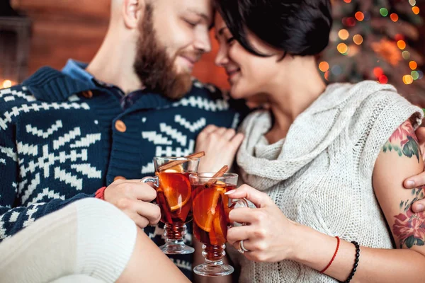 Beautiful couple sitting on the couch — Stock Photo, Image