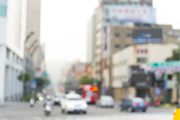 Blurred background. Blurred people walking through a city street.