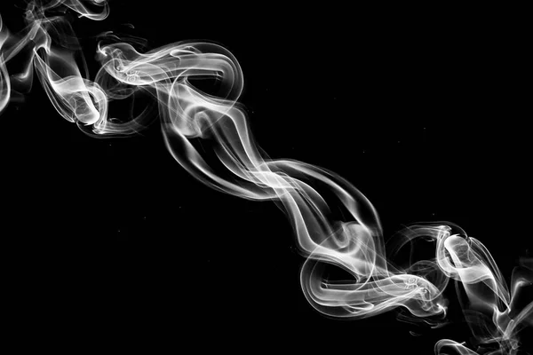 smoke swirls on black background.