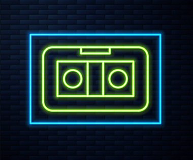 Parlayan neon hattı Vhs video kaset ikonu tuğla duvar arka planında izole edildi. Vektör İllüstrasyonu