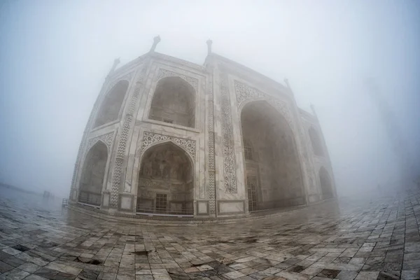 taj mahal covered in fog