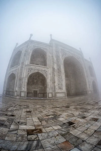 taj mahal covered in fog