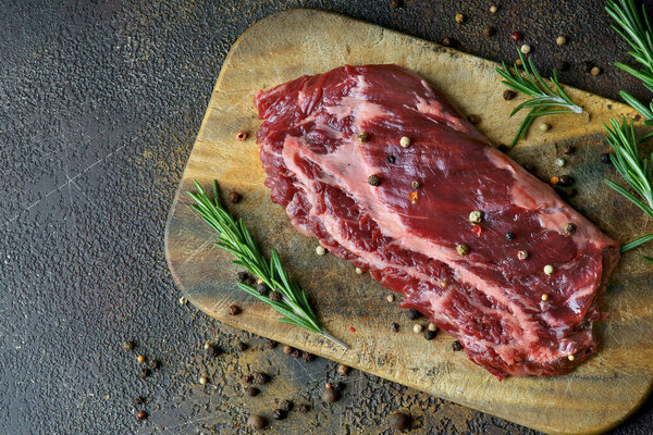 skirt steak on a wooden background