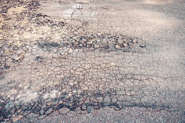 vintage tone image of damaged crack street day time.