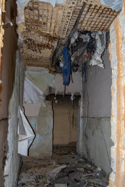 ruined during an earthquake old ruined house - ruined wall of an unsafe house, forgotten things, vertical frame.