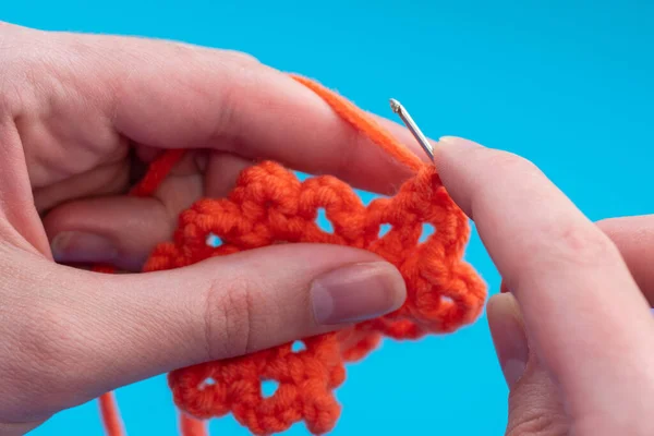 Close Hands Caucasian Woman Crocheting Red Thread Blue Background Copy — Stock Photo, Image