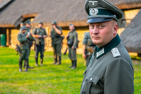 The German officer is dressed in military uniform. Historical reconstruction of episodes of the Second World War in the film \