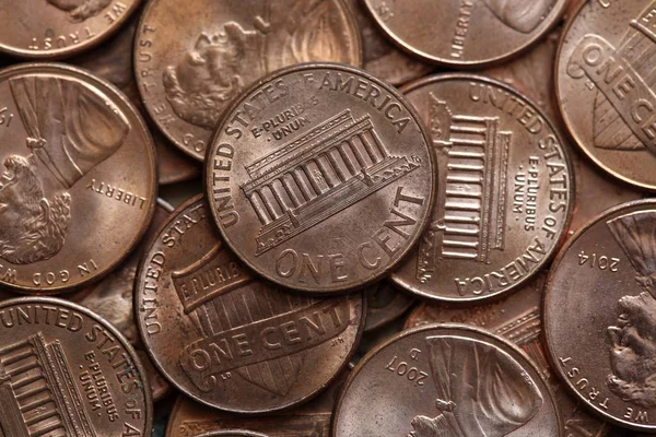 Close up of US one cent coins pile