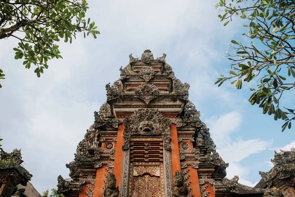 Balinese temple in ubud. A temple gate in Bali with a Barong head statue