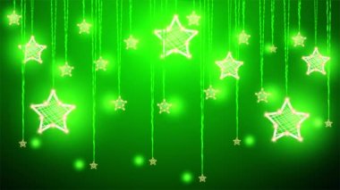 Noel süsleri yıldız yeşil bir arka plan üzerinde asılı