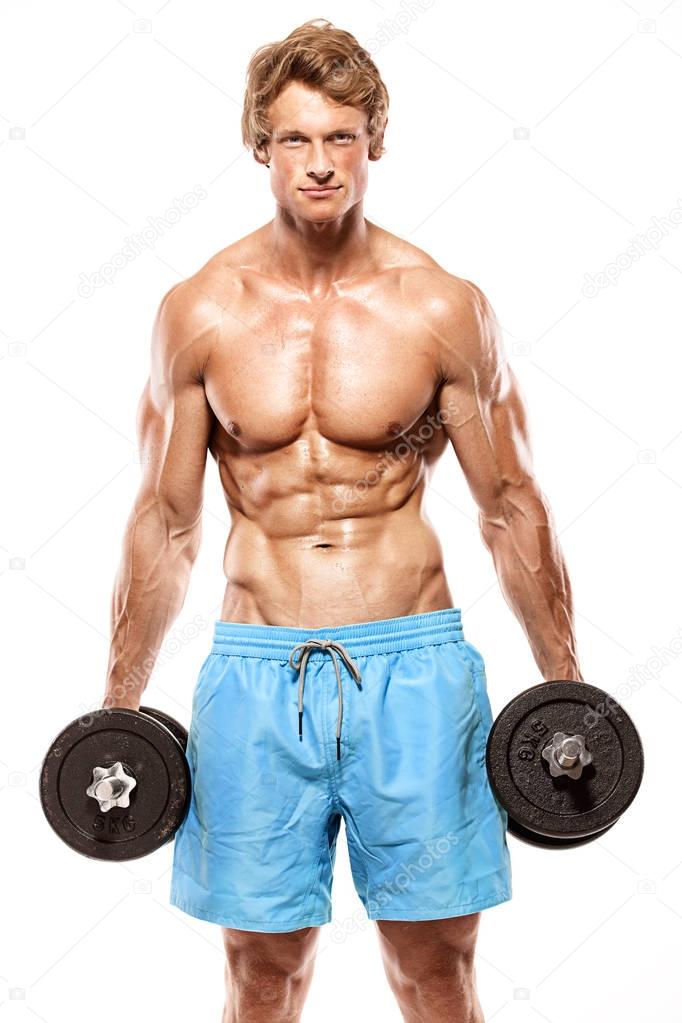 Muscular bodybuilder guy doing exercises with dumbbells — Stock Photo