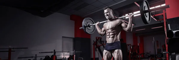 Muscular bodybuilder guy doing exercises with dumbbell — Stock Photo, Image