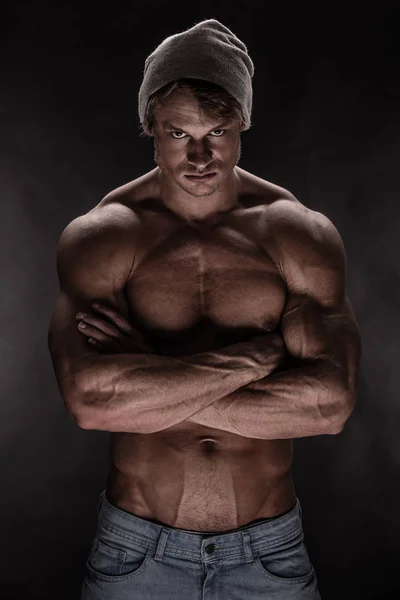 Portrait of strong Athletic Fitness man  over black background — Stock Photo, Image