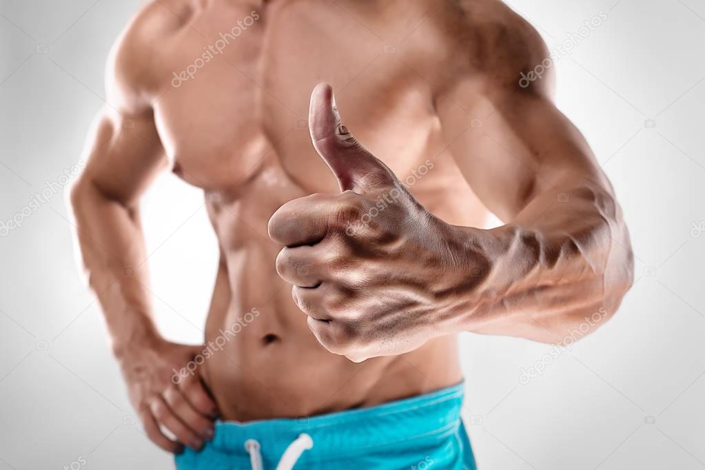 man bodybuilder showing thumbs up gesture