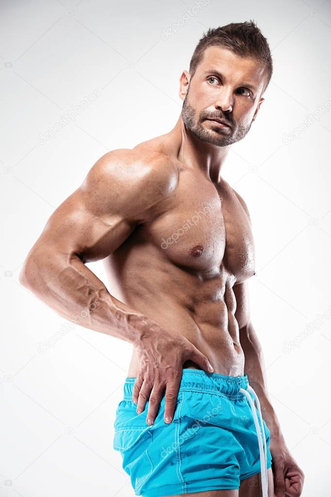 man bodybuilder showing muscular body 