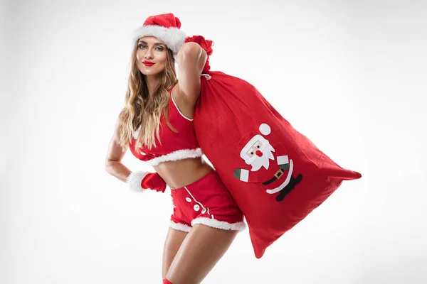 Menina sexy bonita usando roupas de Papai Noel — Fotografia de Stock