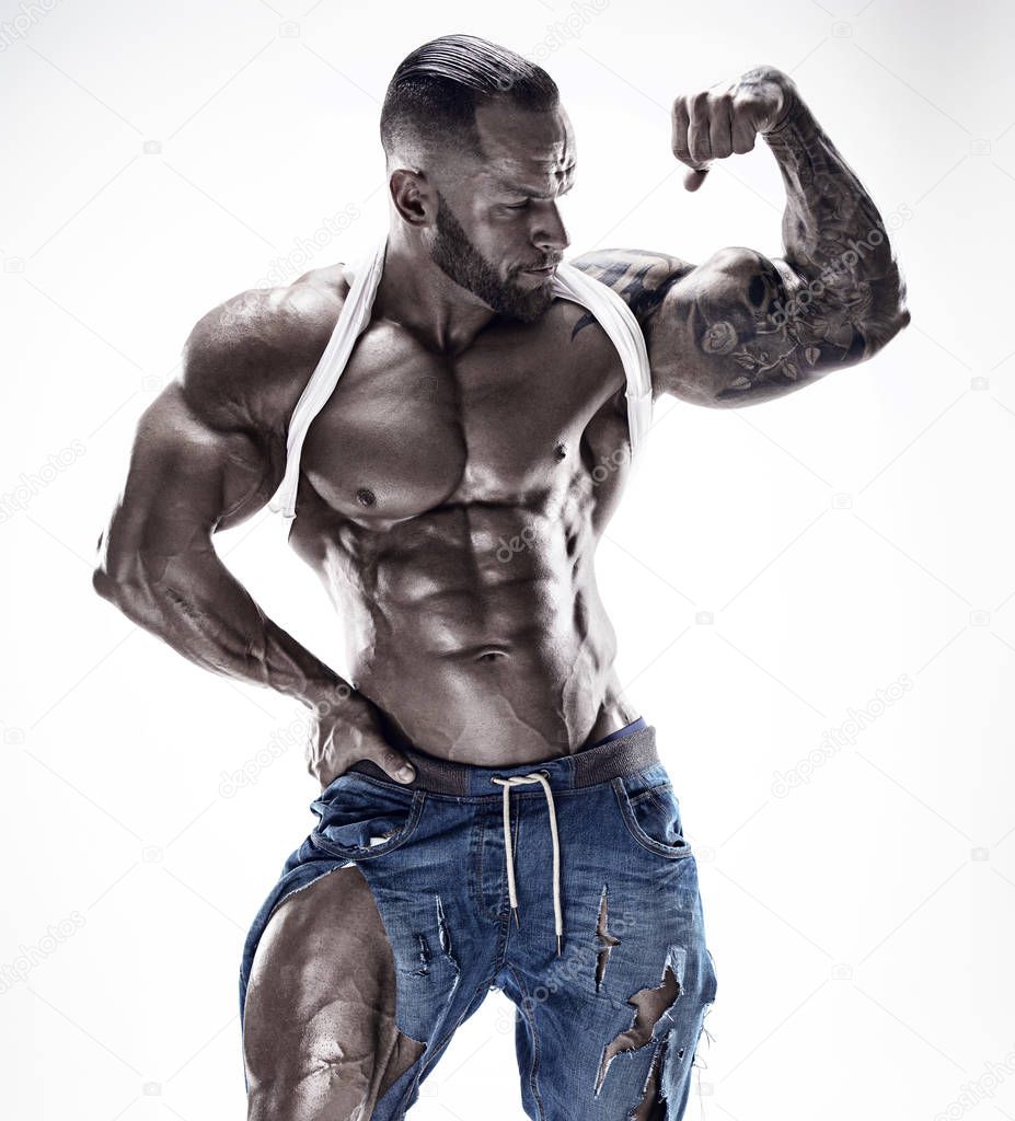 portrait of strong Athletic Fitness man showing big muscles