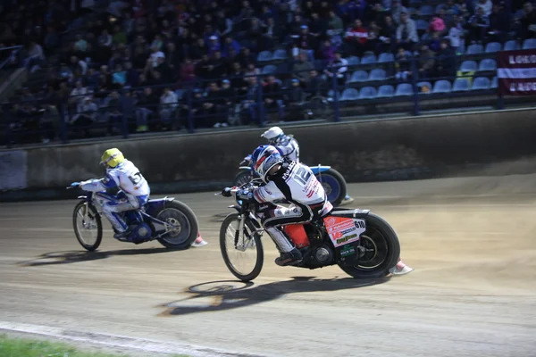 Speedway riders on the track in match — Stockfoto