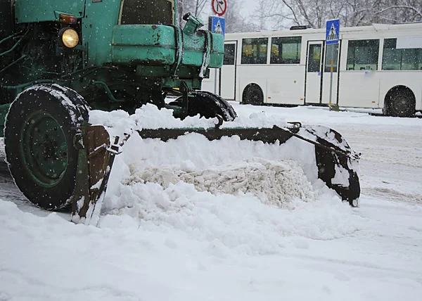 Snow removal vehicle removing snow