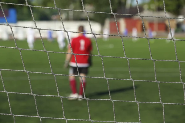 Achteraanzicht van voetbal keeper — Stockfoto