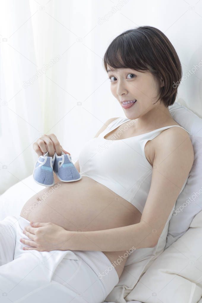 young beautiful Asian pregnant woman