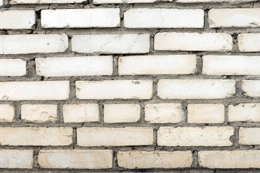 Eski, kirli, beyaz tuğladan bir duvarın arka planı. Alçı, boyalı duvarlar, doku.