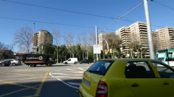 Barcelona Diagonal Avenue Boulevard Camera Car. Typical city center life Barcelona landscape with Tram streetcar crossing the street.Landmarking and driving through the streets of Barcelona city center.Buildings and streeets in downtown Barcelona. — Stock Video