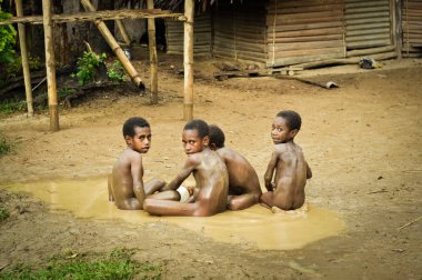 Four boys in mud clipart