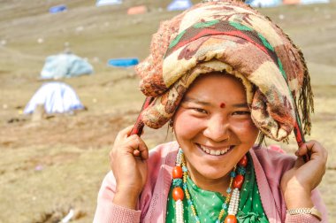 Smiling woman with red dot in Nepal clipart