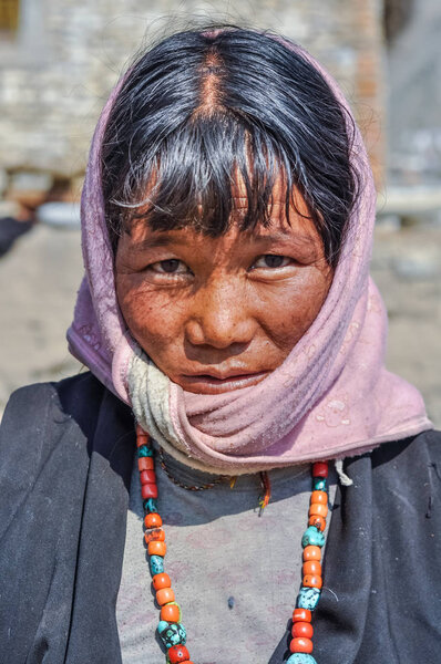 Black-haired woman with beads in Nepal
