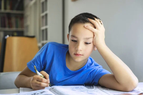 Young boy writing homework. — Stock Photo, Image