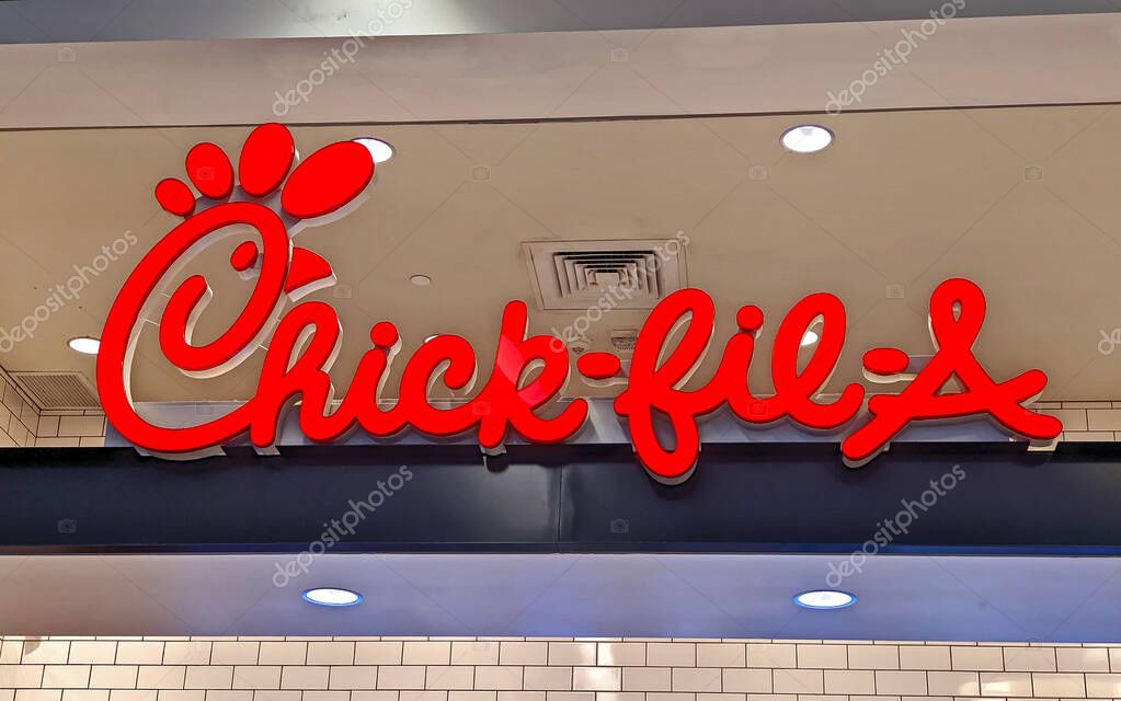 Chick-Fil-A fast food restaurant sign above menu ordering counter, food court shopping mall