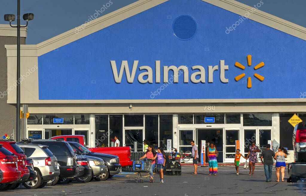 Walmart storefront customers come and go