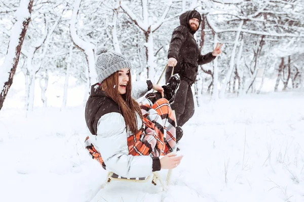 Happy winter holidays. Romantic young couple. Snowy winter day. — Stock Photo, Image