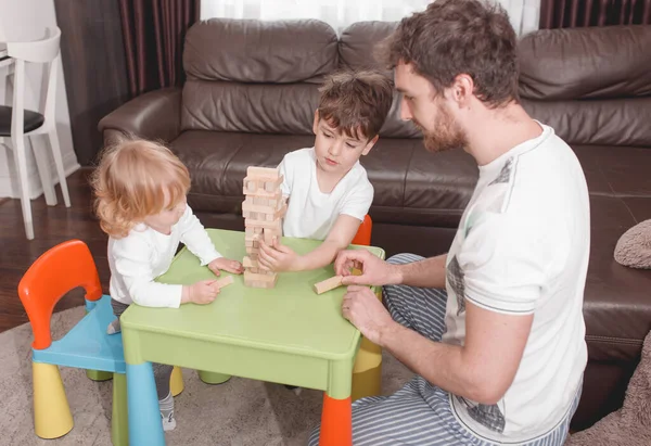 Father's day. Daddy Spend Time with children. Happy Holiday. Father  plays with children. Spending time at home.